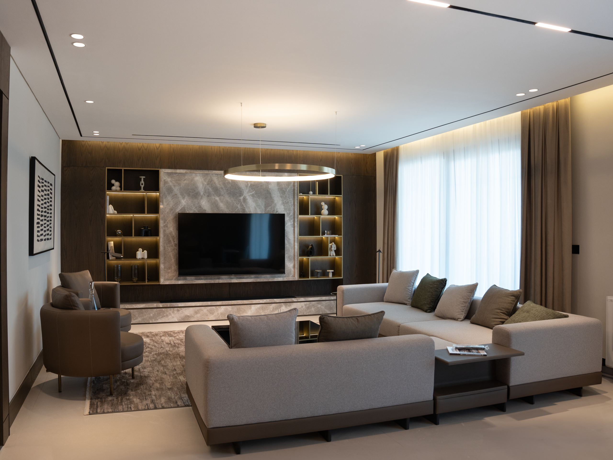 Spacious modern living room with luxury decor and minimalist design elements.